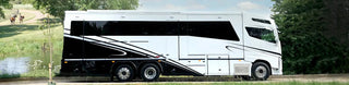 Luxury motorhome with sleek black and white design, suitable for a camper van lifestyle.