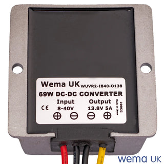 Close-up of a 12V DC Voltage Regulator power supply with wires for regulated current