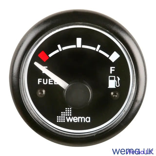 Analogue fuel level gauge with black face and white markings for fuel tank level